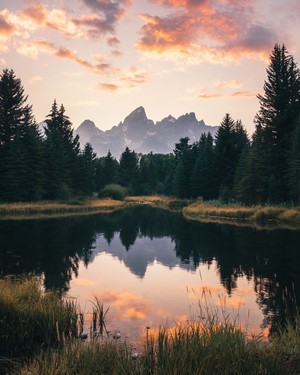 Mountains reflected in a lake at sunset