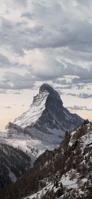 Matterhorn mountain in snow at dusk