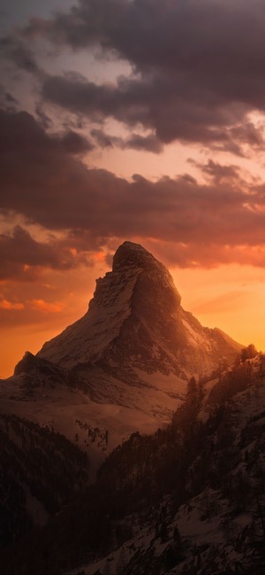 Matterhorn mountain at sunset with dramatic clouds