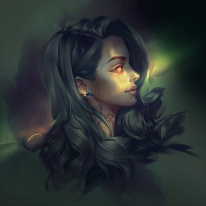 Woman with orange eyes and tattoos