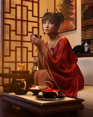 Woman in red dress holding a cup indoors