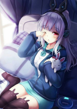Anime girl with headphones and bunny ears in bed