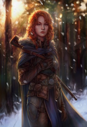 Redheaded woman with rifle in snowy forest