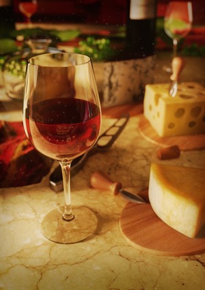 Wine glass with red wine and cheese