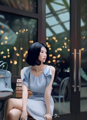 Woman in blue dress sitting at a table with handbag