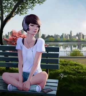 Woman with headphones sitting on a park bench