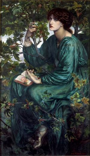 Woman in green dress reading a book in a tree