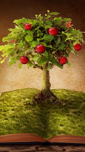 Apple tree growing from an open book