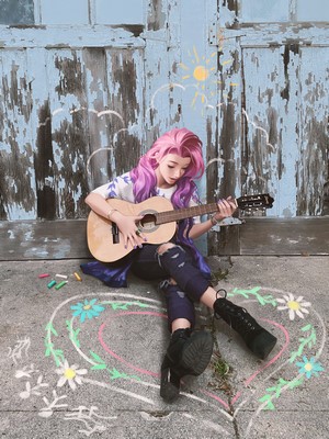Seraphine from League of Legends playing guitar