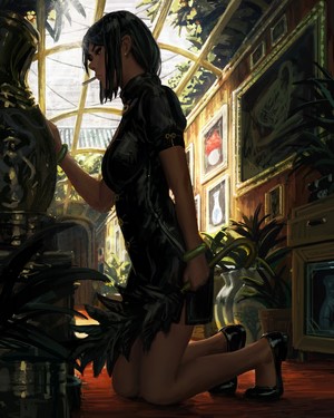 Woman in black dress kneeling in greenhouse
