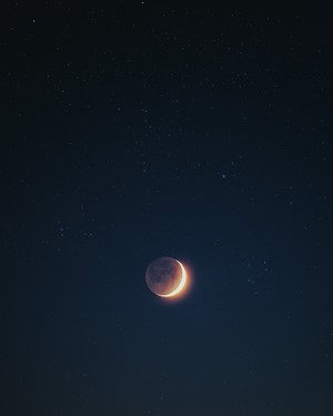 Crescent Moon in a Starry Night Sky