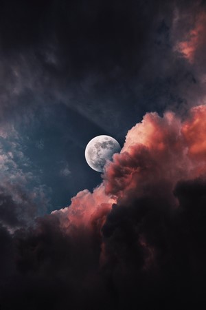 Moon behind dramatic clouds