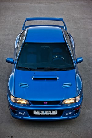 Blue Subaru Impreza WRX STi with spoiler