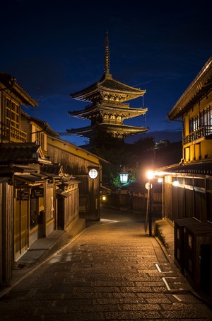 Pagoda on a cobblestone street at night in Japan