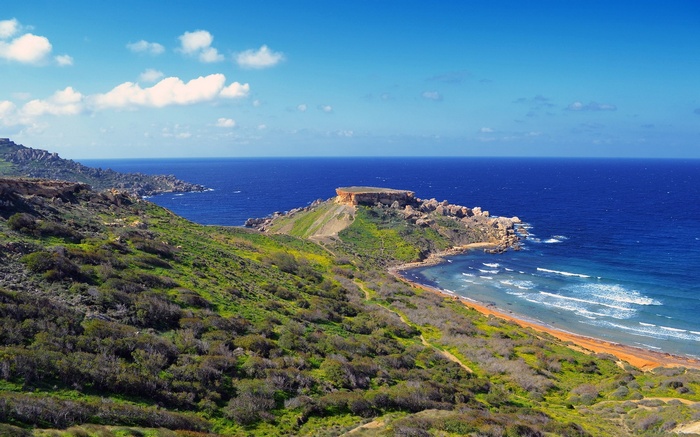 Coastal landscape with rocky cliffs and blue sea