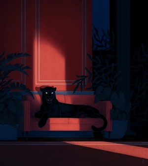 Black panther resting on a red couch in a dimly lit room