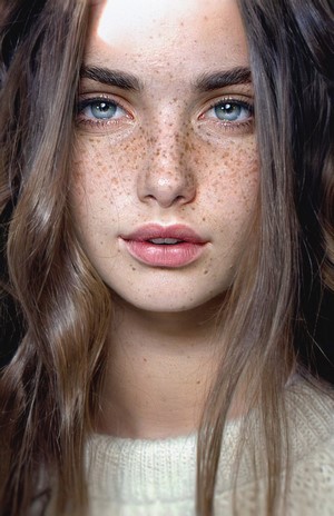 Woman with freckles and blue eyes