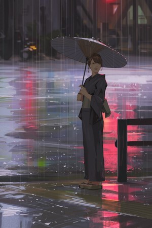 Woman in kimono holding an umbrella in the rain