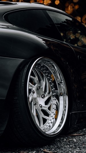 Black Porsche 996 with custom chrome rims