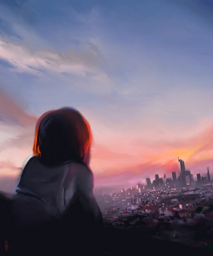 Woman watching sunset over city