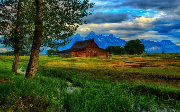 Barn in front of mountains