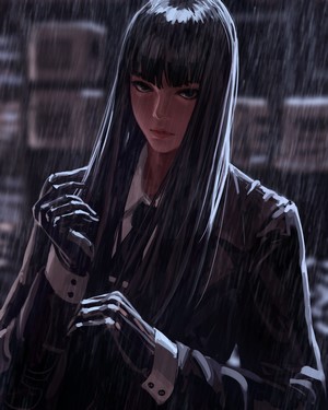 Woman in suit standing in the rain