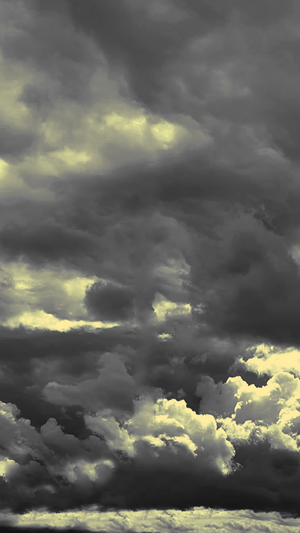Dark and stormy clouds with yellow light