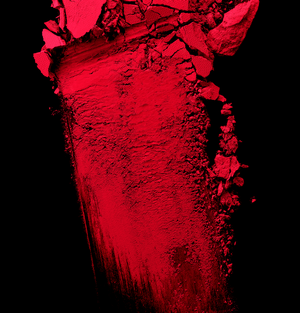 Abstract red powder splash on black background