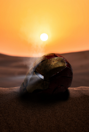 Iron Man helmet in the desert at sunset