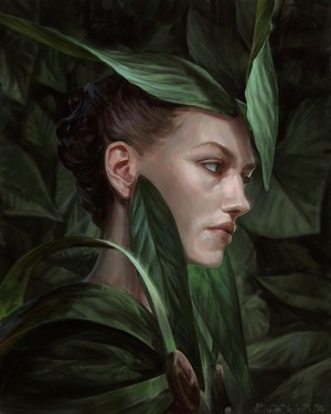 Woman's face hidden by large green leaves