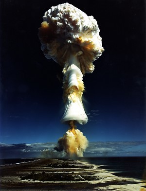 Atomic bomb mushroom cloud over atolls