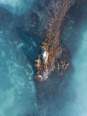 Aerial view of a rocky outcrop in the ocean