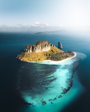 Island with rocky cliffs and turquoise water