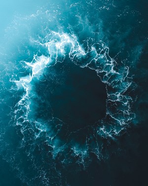 Aerial view of swirling ocean water