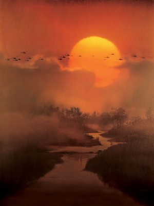 Helicopters flying over a misty river at sunset