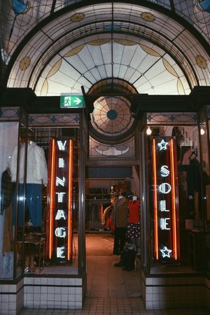 Vintage clothing store with neon signs
