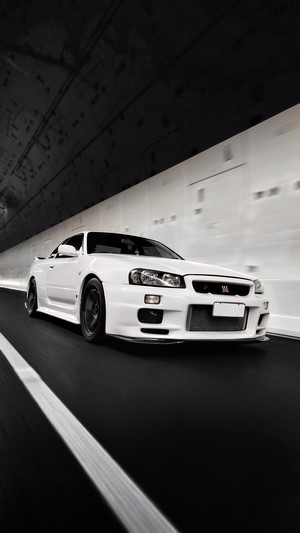 White Nissan GT-R driving through a tunnel
