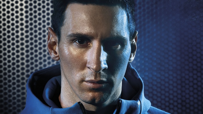 Lionel Messi wearing a blue hoodie