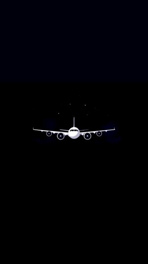 Airplane flying in the night sky