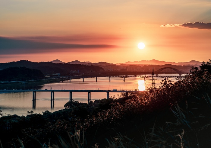 Sunset over bridges and mountains
