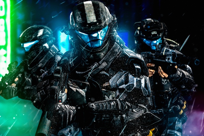 Three soldiers in futuristic armor with guns
