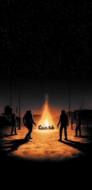 Astronauts gathered around a campfire under a starry sky