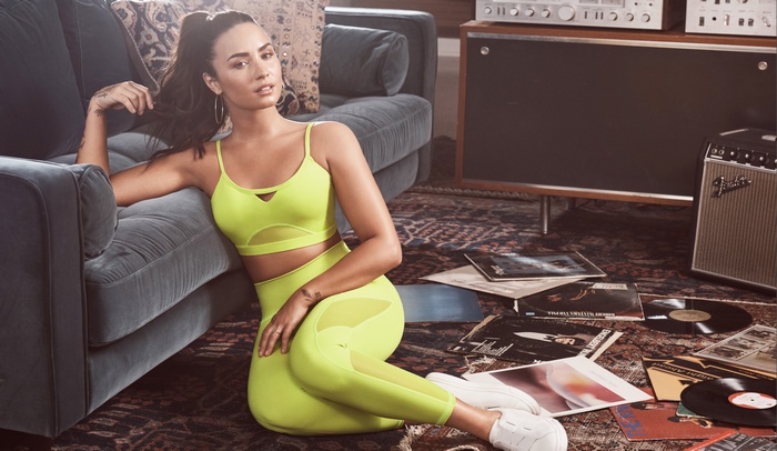 Demi Lovato in neon yellow athletic wear
