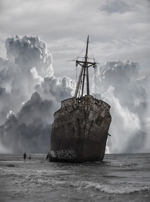 Shipwreck on the coast with stormy clouds