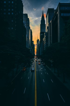 New York City street with Chrysler Building at sunset