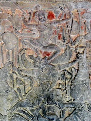 Garuda battling a demon in Hindu temple relief