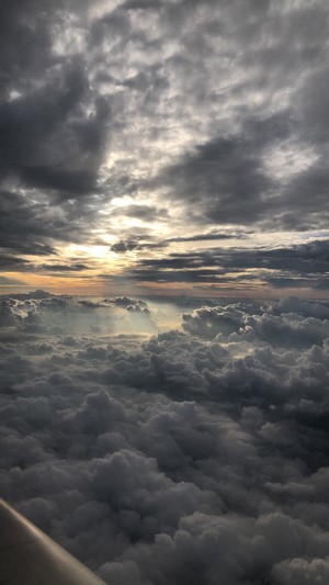 Sunlight breaking through dark clouds from above