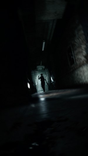 Leon S. Kennedy from Resident Evil 2 Remake in a dark hallway