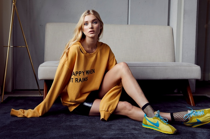 Elsa Hosk wearing a yellow sweatshirt
