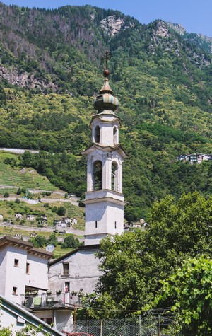 Church bell tower in a mountain village, Italy